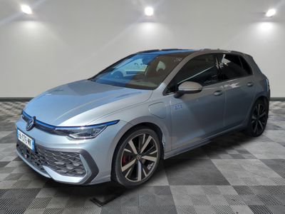 a grey volkswagen golf gt - line is parked in a garage
