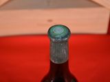 a bottle of wine that is sitting on a table