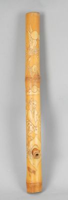 a tall wooden tube with a design on it