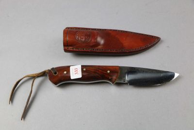 two knives that are sitting next to each other on a table
