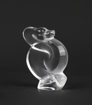 a close up of a glass sculpture of a bird on a black background