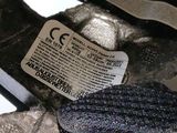 a close up of a pair of shoes with a tag on them
