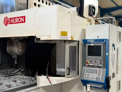 a machine that is working on a machine in a factory