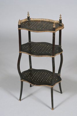 a black and gold shelf with three shelves on it