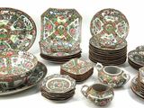 many plates and cups that are sitting on a table