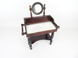 a small table with a mirror on top of it