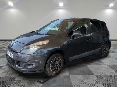 a picture of a grey car parked in a garage