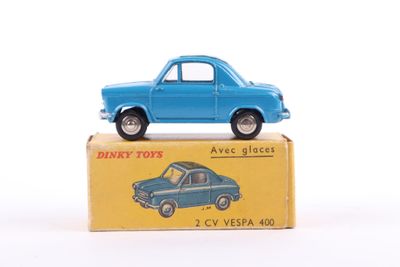 a blue toy car sitting on top of a yellow box
