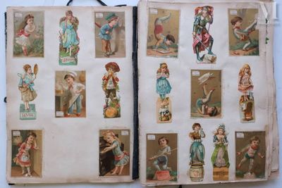 an open book with pictures of children playing with toys on it