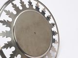 a silver plate with a circular design on it
