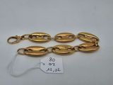 a gold plated bracelet with oval links and clasps