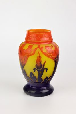 a vase that is sitting on a stand on a white surface
