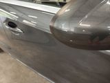 a close up of a car ' s side view mirror and door handle