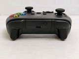 a close up of a video game controller on a table