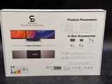 the box is open on a black surface with a picture of a laptop in it