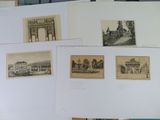 a lot of old photographs on the table