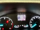 a close up of the dashboard of a car with the lights on