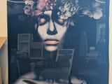 a picture of a woman with a flower crown on her head