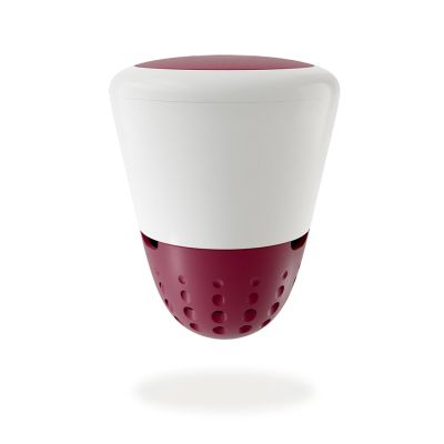 a red and white cup that is on a table