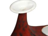 a red vase with a blue and white design on it