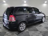 a picture of a black minivan parked in a garage
