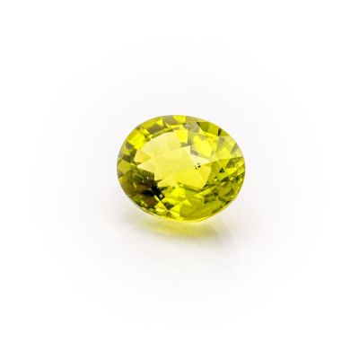 a yellow sapphire stone on a white background