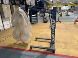 an image of a crane in a warehouse with a tarp on it