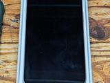 a cell phone that is sitting in a box on a table