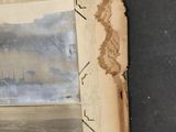 an old book with a picture of a city on it