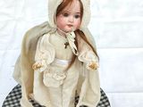a small doll that is sitting on a table