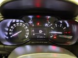 a close up of a car dashboard with a speedometer and gauges