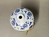 a blue and white vase sitting on a table