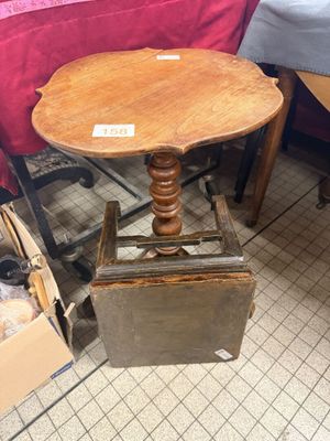 a small table with a wooden top and a metal base