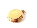 an image of a close up of a pocket watch on a white surface