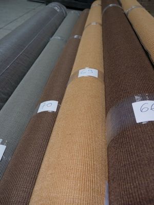 many different colors of carpet on display in a store