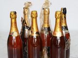 six bottles of champagne are lined up on a table
