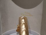 a gold box with a gold ring inside of it