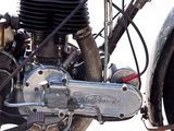 a close up view of a motorcycle engine on the ground