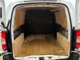 a white van with the back door open and the back of the van is empty