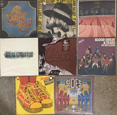 various album covers of various albums and albums on the floor