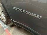 a close up of a car ' s emblem on the side of the car