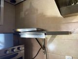 an image of a kitchen with a stove and a stove top