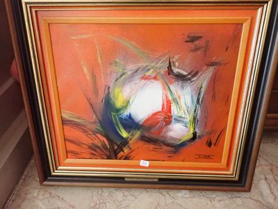 tableau représentant un ballon de football dans un cadre posé sur un sol en marbre