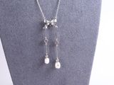 a close up of a necklace on a mannequin mannequin