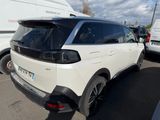 the rear end of a white suv parked in a parking lot