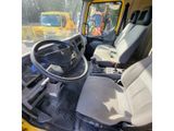 a view of the inside of a vehicle from the driver ' s seat