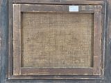 an old picture of a picture frame on a wall with a tag on it