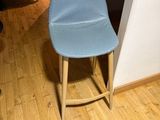 a blue chair in the corner of a room