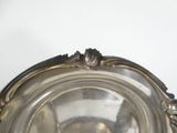 a silver plate that is sitting on a table
