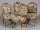 four antique chairs with floral upholstered upholstered cushions